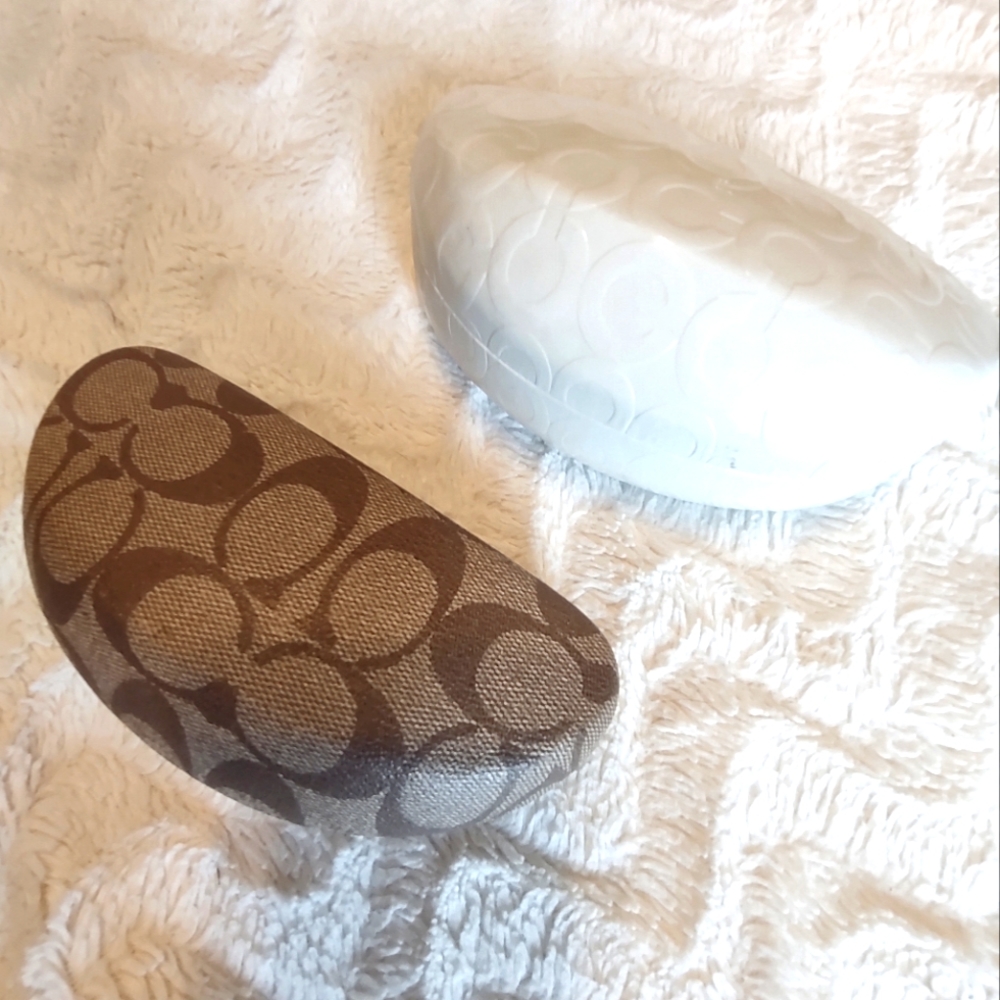 Two COACH Sunglass Cases. One tan with logo second white with logo.